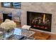 Close up of fireplace with tile surround and reading nook at 2211 E Camelback Rd # 902, Phoenix, AZ 85016