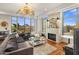 Comfortable living room with fireplace and sweeping views at 2211 E Camelback Rd # 902, Phoenix, AZ 85016