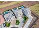 Aerial view displays the home, landscaping, driveway, and outdoor pool area with covered patio at 22771 N 98Th Dr, Peoria, AZ 85383