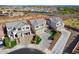Aerial view of a suburban home in a neighborhood, featuring a manicured lawn and a two-car garage at 22771 N 98Th Dr, Peoria, AZ 85383