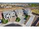 Aerial photo showcases multiple homes in a neighborhood with desert landscaping and community walking paths at 22771 N 98Th Dr, Peoria, AZ 85383