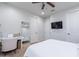 Bedroom featuring a vanity mirror, a mounted TV, and comfortable bed at 22771 N 98Th Dr, Peoria, AZ 85383