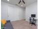 Bedroom featuring a sliding-door closet and a desk area at 22771 N 98Th Dr, Peoria, AZ 85383