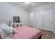 Bright bedroom showcasing slider closet, flooring and neutral color palette at 22771 N 98Th Dr, Peoria, AZ 85383