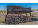 Community entrance sign for Liberty Park in Peoria Arizona, set amid desert landscaping and native plants at 22771 N 98Th Dr, Peoria, AZ 85383