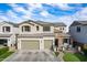 Charming two-story home featuring a stone facade, two-car garage, and well-maintained front yard at 22771 N 98Th Dr, Peoria, AZ 85383