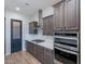 Well-equipped kitchen boasts stainless steel appliances, granite counters, and a convenient pantry door at 22771 N 98Th Dr, Peoria, AZ 85383