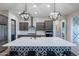 Bright kitchen featuring a center island with seating, pendant lights, and stainless steel appliances at 22771 N 98Th Dr, Peoria, AZ 85383