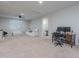 Spacious living room area with carpet flooring and neutral color palette at 22771 N 98Th Dr, Peoria, AZ 85383