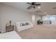 Bright second floor living room featuring carpet flooring and neutral color palette at 22771 N 98Th Dr, Peoria, AZ 85383