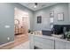 View of stylishly decorated home office with motivational decor and wood flooring at 22771 N 98Th Dr, Peoria, AZ 85383