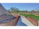 Scenic walking path with landscaped borders and natural elements, offering a tranquil setting for outdoor activities at 22771 N 98Th Dr, Peoria, AZ 85383