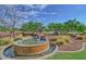 Attractive water feature and community sign, enhancing the curb appeal with greenery and a tranquil atmosphere at 22771 N 98Th Dr, Peoria, AZ 85383
