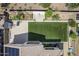 An aerial view showcases an artificial turf backyard and patio, perfect for relaxation and entertainment at 22960 N 94Th Ln, Peoria, AZ 85383