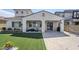 Spacious backyard with lush artificial grass and a covered patio area at 22960 N 94Th Ln, Peoria, AZ 85383