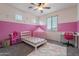 bedroom featuring a playful pink theme and bright natural light at 22960 N 94Th Ln, Peoria, AZ 85383