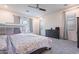 Bedroom with carpet flooring, bunk bed, dresser, and window with gray curtains at 22960 N 94Th Ln, Peoria, AZ 85383