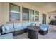 Inviting covered patio features comfortable seating and tiled flooring at 22960 N 94Th Ln, Peoria, AZ 85383