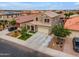 Aerial shot of a charming two-story home featuring a well-maintained lawn, three-car garage and solar panels at 2322 E Mews Rd, Gilbert, AZ 85298