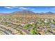 Expansive aerial shot of a desert community with stunning mountain views, well-maintained landscaping at 2322 E Mews Rd, Gilbert, AZ 85298