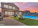 Private backyard with a refreshing pool, lounge chairs, and landscaped surroundings creates an ideal outdoor oasis at 2322 E Mews Rd, Gilbert, AZ 85298