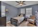 Cozy bedroom with a ceiling fan, plantation shutters and natural light at 2322 E Mews Rd, Gilbert, AZ 85298