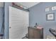 This bedroom features a closet with sliding doors and hardwood floors at 2322 E Mews Rd, Gilbert, AZ 85298