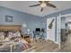 This bedroom features a desk, wood furniture, and hardwood floors at 2322 E Mews Rd, Gilbert, AZ 85298