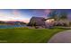 Beautiful community clubhouse overlooking a well-manicured lawn and the lake with fountains at 2322 E Mews Rd, Gilbert, AZ 85298