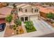 Stunning two-story home featuring a well-manicured front yard and a welcoming covered porch at 2322 E Mews Rd, Gilbert, AZ 85298