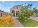 Charming front yard with mature trees, manicured lawn, and a paver walkway leading to a welcoming entrance at 2322 E Mews Rd, Gilbert, AZ 85298