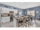 Bright kitchen featuring granite countertops, stainless steel appliances, and a cozy breakfast nook with a view at 2322 E Mews Rd, Gilbert, AZ 85298