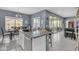 Bright and open kitchen with a granite island, stainless steel appliances, and eat-in dining area at 2322 E Mews Rd, Gilbert, AZ 85298