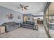 Relaxing living room area with tile floors, comfortable sofas, and open access to the kitchen at 2322 E Mews Rd, Gilbert, AZ 85298