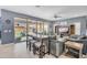Comfortable living room featuring tile floors, a ceiling fan, and sliding glass doors to the outdoor patio at 2322 E Mews Rd, Gilbert, AZ 85298