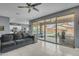 This inviting living room features comfortable seating and opens to a covered patio and swimming pool at 2322 E Mews Rd, Gilbert, AZ 85298