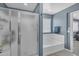 A stunning main bathroom with a walk-in shower, soaking tub, and a window for natural light at 2322 E Mews Rd, Gilbert, AZ 85298