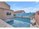 Beautiful backyard pool with a mural wall, nice patio and artistic accents creating a private retreat at 2322 E Mews Rd, Gilbert, AZ 85298
