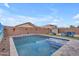 Inviting backyard pool featuring a sun shelf, relaxing ambiance, and easy access at 2322 E Mews Rd, Gilbert, AZ 85298