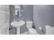 This well-lit powder room has a pedestal sink and tile flooring at 2322 E Mews Rd, Gilbert, AZ 85298
