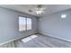 Bedroom featuring laminate floors, neutral paint, and a ceiling fan at 23773 W Hammond Ln, Buckeye, AZ 85326
