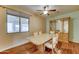 Formal dining room with natural light, laminate floors, and dining room set at 23773 W Hammond Ln, Buckeye, AZ 85326
