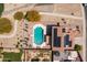 Aerial view of a property featuring a pool, solar panels, and desert landscaping at 25606 W Satellite Ln, Buckeye, AZ 85326