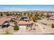 Aerial view of a two-story home with a desert landscape in a quiet suburban neighborhood at 25606 W Satellite Ln, Buckeye, AZ 85326