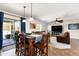 Open floorplan connecting the dining area and living room for modern living at 25606 W Satellite Ln, Buckeye, AZ 85326