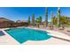 Sparkling pool with desert landscaping, diving board, and privacy fence at 25606 W Satellite Ln, Buckeye, AZ 85326