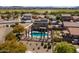 Aerial view of a home and backyard pool with desert landscaping in a quiet suburban neighborhood at 25606 W Satellite Ln, Buckeye, AZ 85326