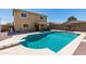 A backyard swimming pool with diving board and patio furniture perfect for outdoor relaxation at 25606 W Satellite Ln, Buckeye, AZ 85326