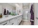 Bright bathroom featuring double sinks, a large mirror, and a glass-enclosed walk-in shower at 2822 E Hidalgo Ave, Phoenix, AZ 85040