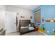 Fun bedroom featuring Super Mario Brothers themed wall decor, neutral carpet, and wood-look furniture at 2822 E Hidalgo Ave, Phoenix, AZ 85040